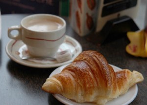 French coffee and croissant A flaky croissant and a good cafe au lait approaches perfection.
